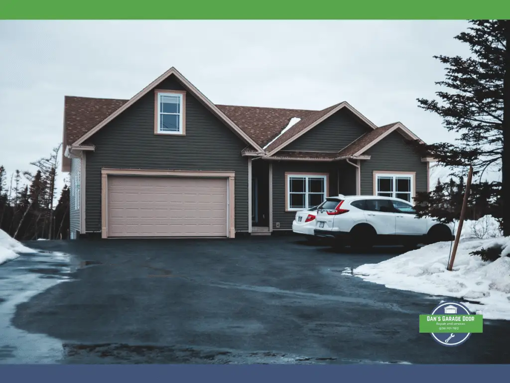 Winterized home with garage door and a car parked outside, surrounded by snow.