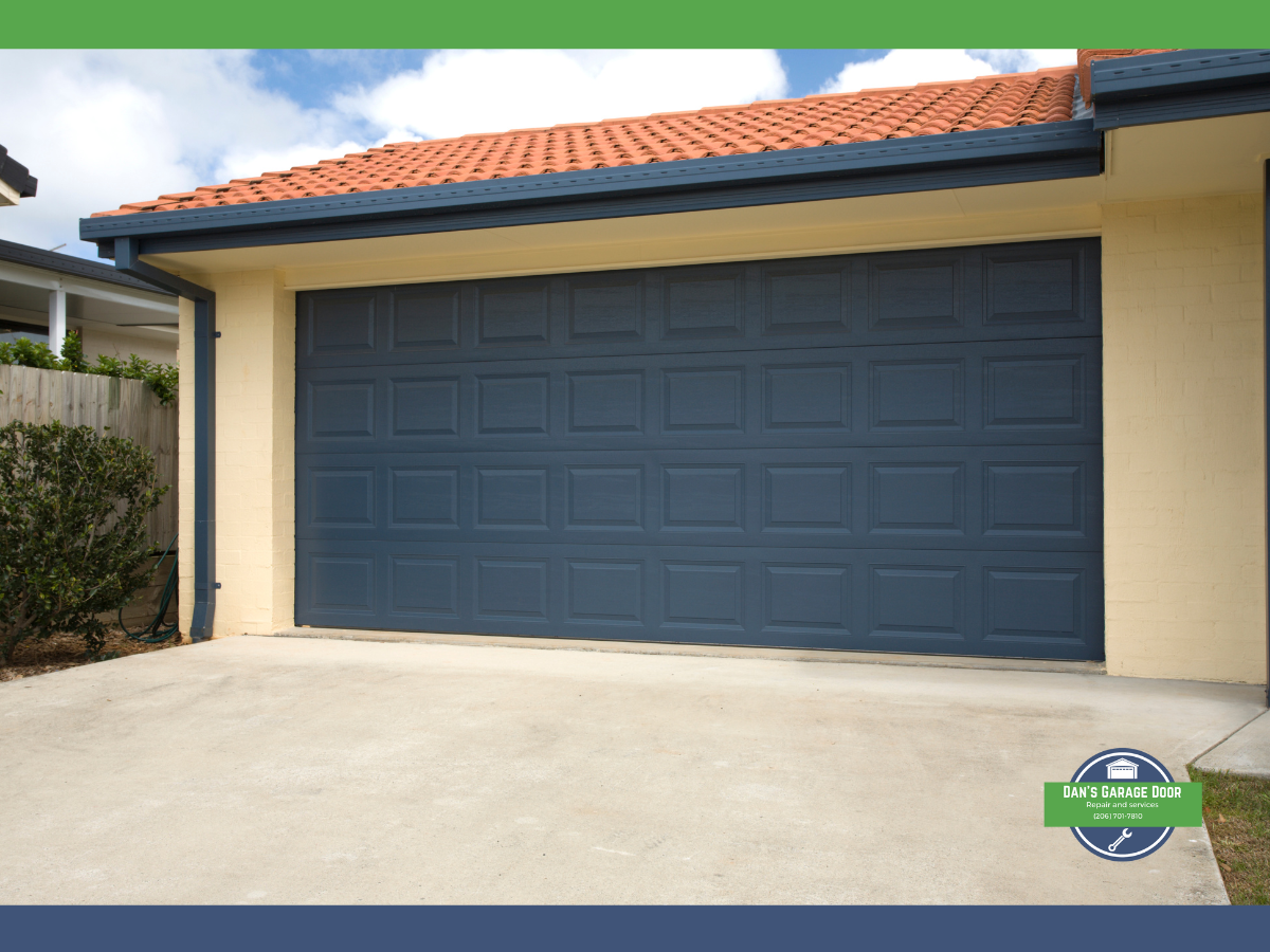 Blue garage door on a house with a terracotta tile roof.