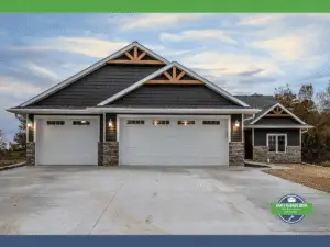 Modern two-car garage with stone accents and wooden architectural details.