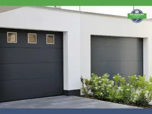 Two black garage doors with square windows and a white wall backdrop.
