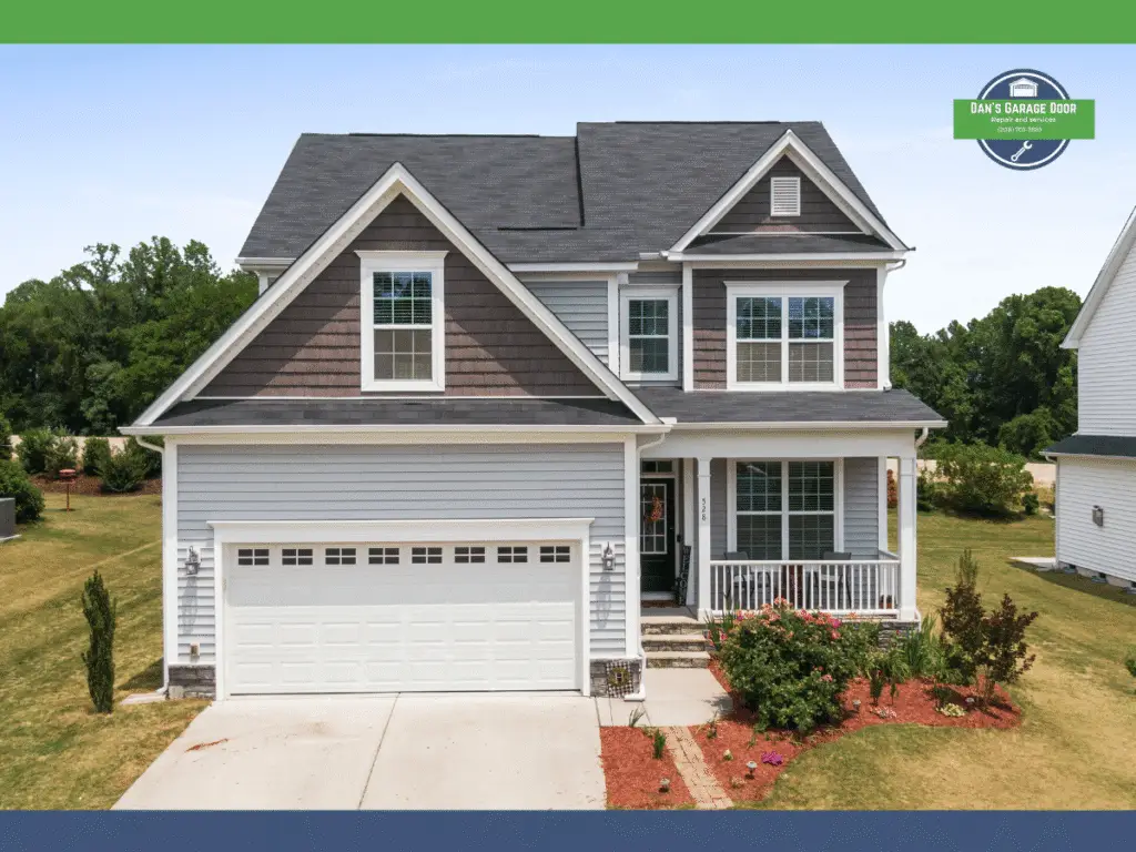 Two-story house with gray siding, brown accents, and a white garage door.