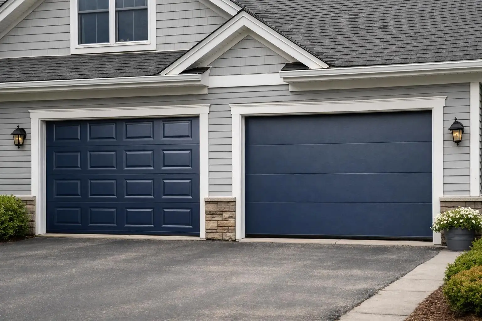 Two navy garage doors, raised panel left and flush panel right