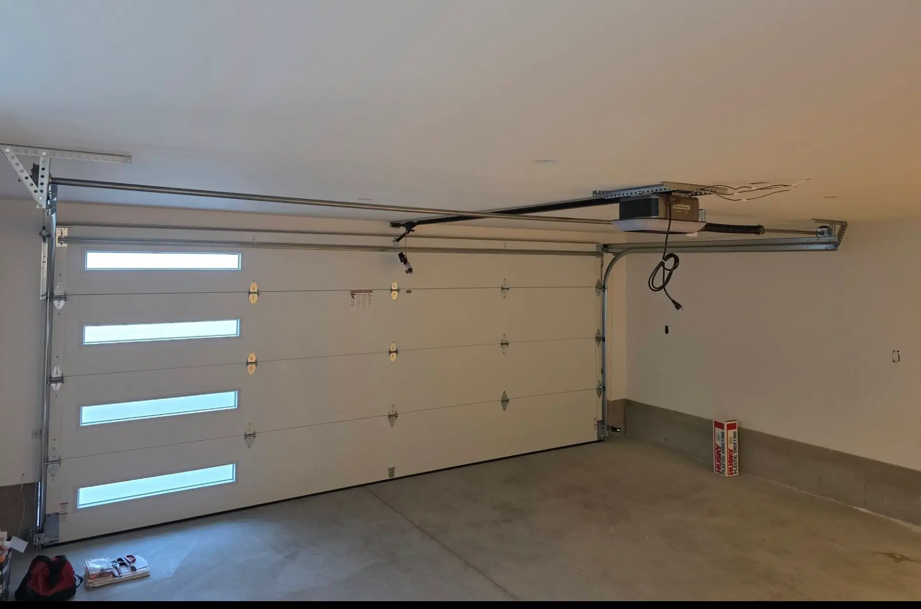 Commercial overhead garage door with four narrow windows