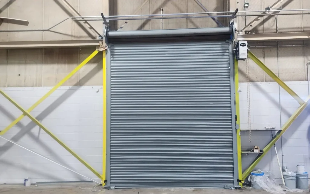 Gray industrial rolling shutter door in warehouse