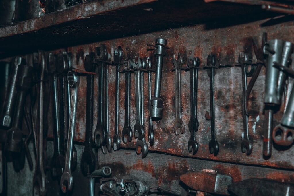 Steel garage door rollers on a workbench